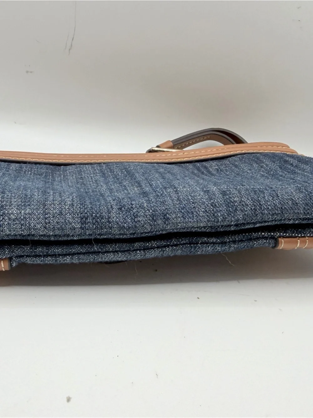 True Religion Denim Wristlet with Tan Trim and Gold Logo